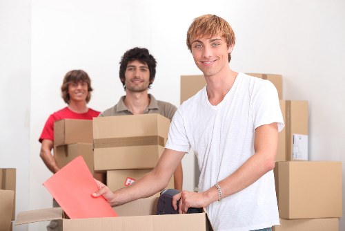 Professional movers handling furniture in a Finsbury Park flat